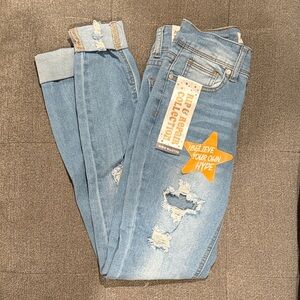 Celebrity Ace skinny cuffed distressed jeans